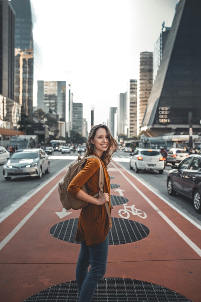Creator posing for a street style photo in the city