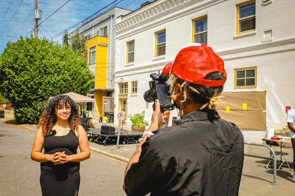 Creator filming a street interview