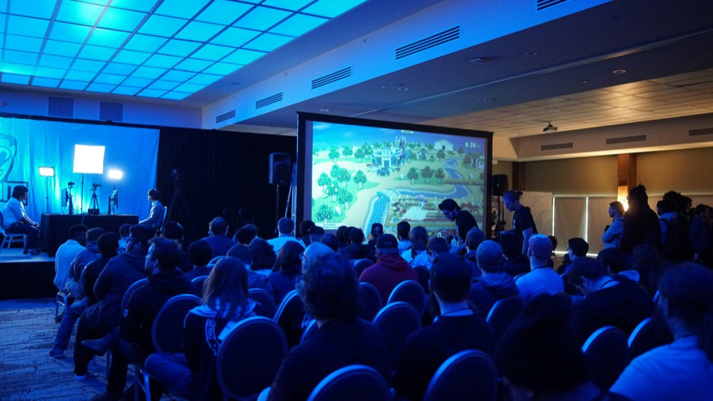 Audience watching a gaming tournament on the big screen