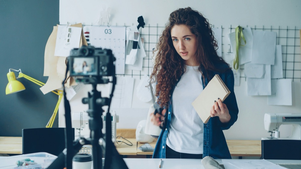 Creator vlogging in a fashion design studio
